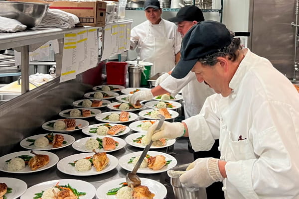 Employees preparing meals for Harvard's Presidential Inauguration